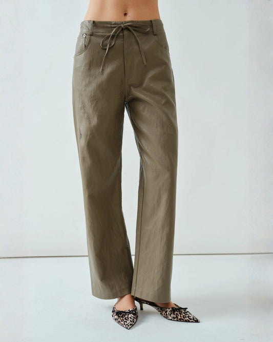 Soft brown faux leather pants styled in an elegant straight-leg design with a smooth, flexible finish.